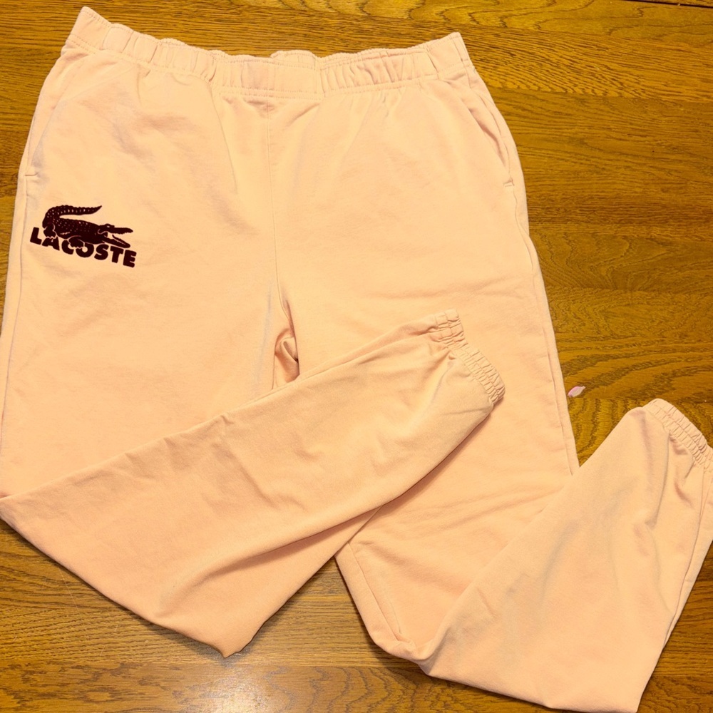 Lacoste medium light orange Joggers with velvet crimson logo